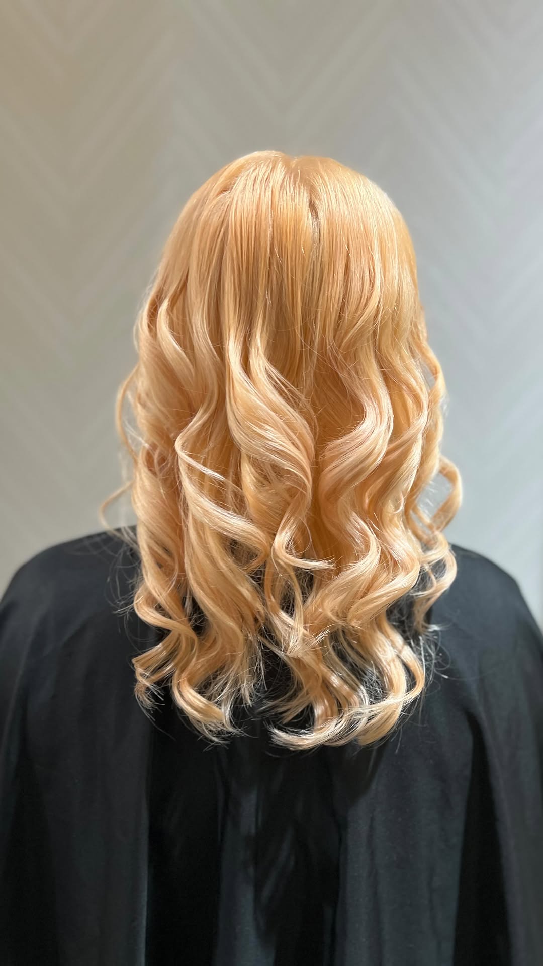 Soft peach-blonde curls styled by Ooh Lala by Frenchie